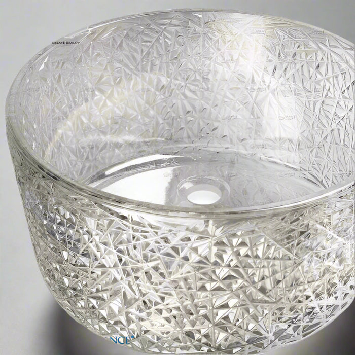 Clear glass bowl with diamond cut pattern.
