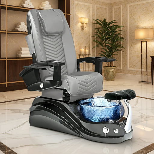 A glossy black pedicure spa chair with a unique floral-shaped basin adorned with iridescent crystals, featuring leather seats and a metal structure. A 'Limited 2-Year Warranty' badge is displayed on the chair.