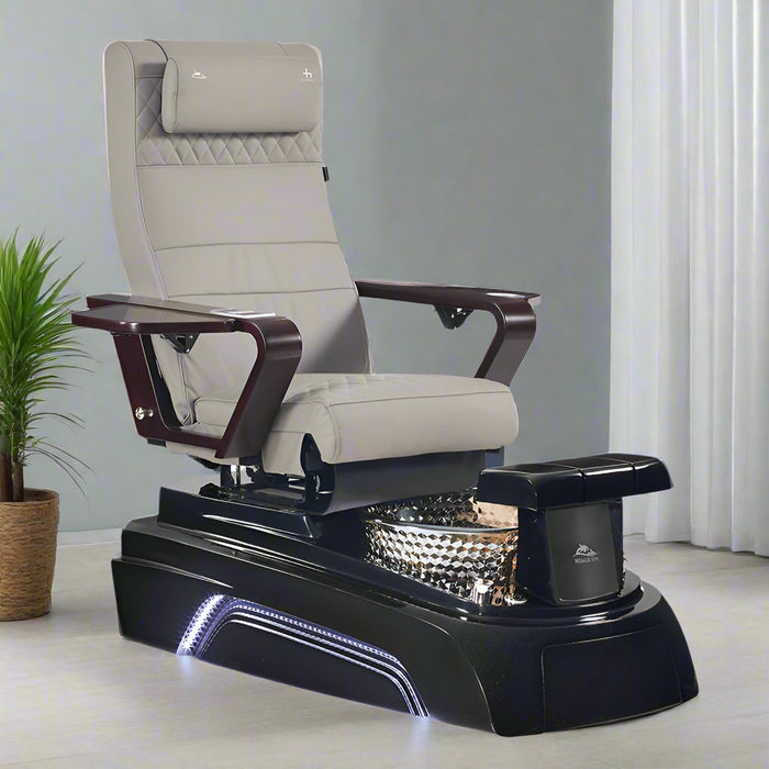 A black pedicure spa chair with a wooden armrest and base, featuring airbag movement technology and a built-in basin with LED lighting.