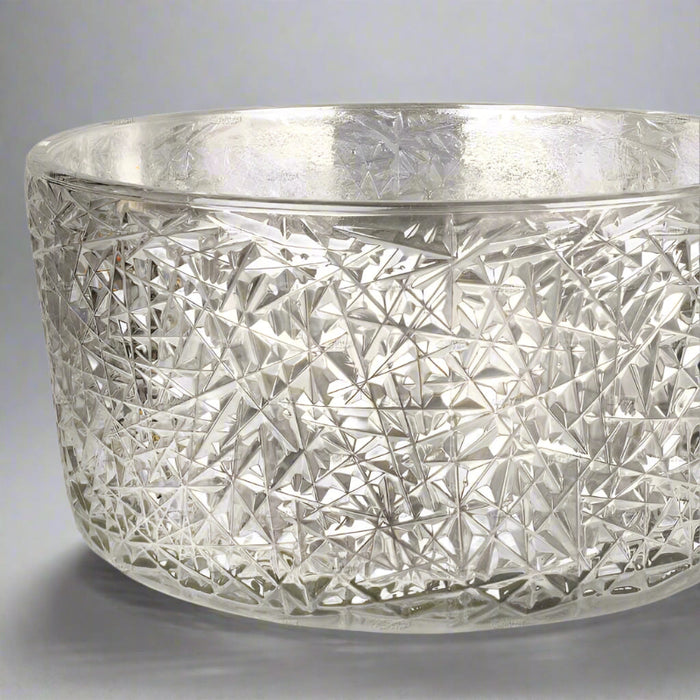 Decorative glass bowl with geometric pattern.