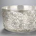 Decorative glass bowl with geometric pattern.