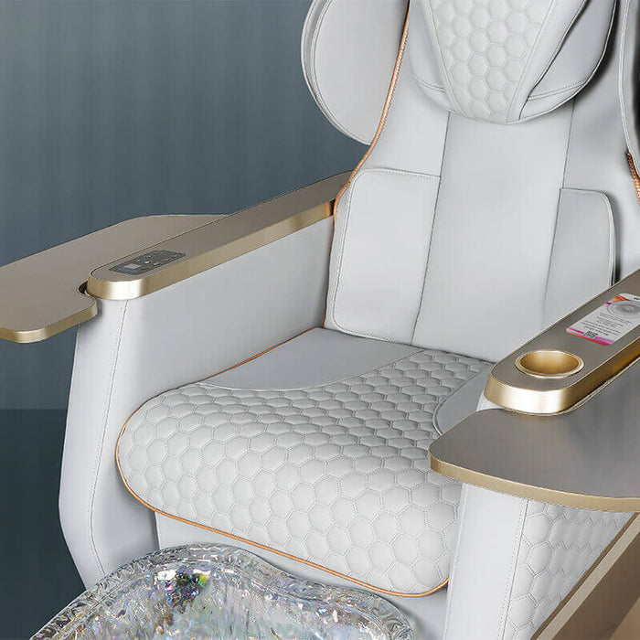Luxury airplane seat with quilted design and gold accents on a dark background