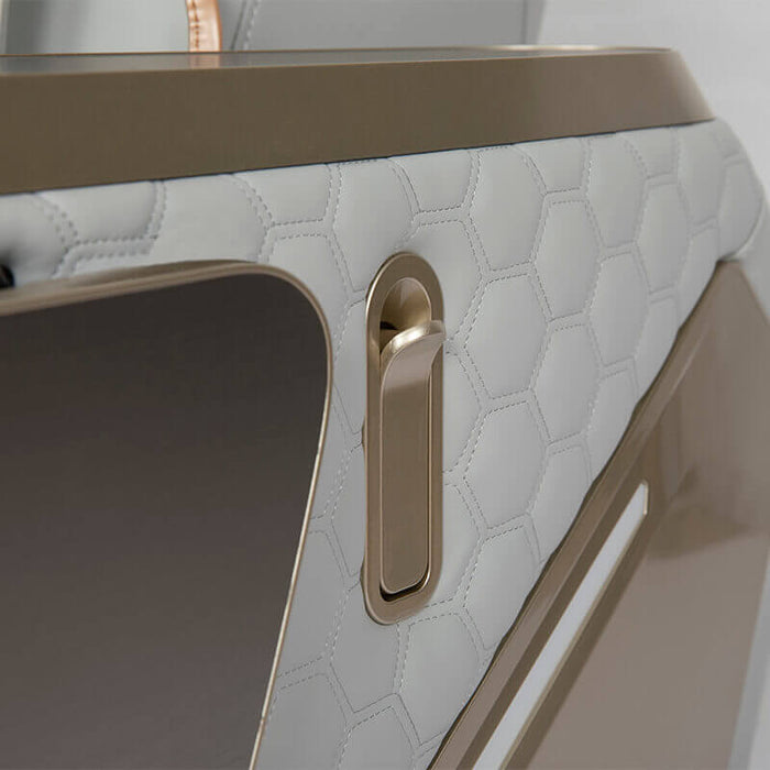 Hanger close-up of a textured surface with a gold handle and trim.