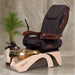 A contemporary pedicure spa chair with a sleek design, featuring a brown and beige color scheme, a footrest, and an ergonomic seating arrangement.