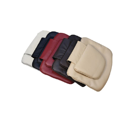 An array of headrest cushions for pedicure chairs, displayed in a range of colors including beige, black, chocolate, gray, terra red and each with a different texture and design.