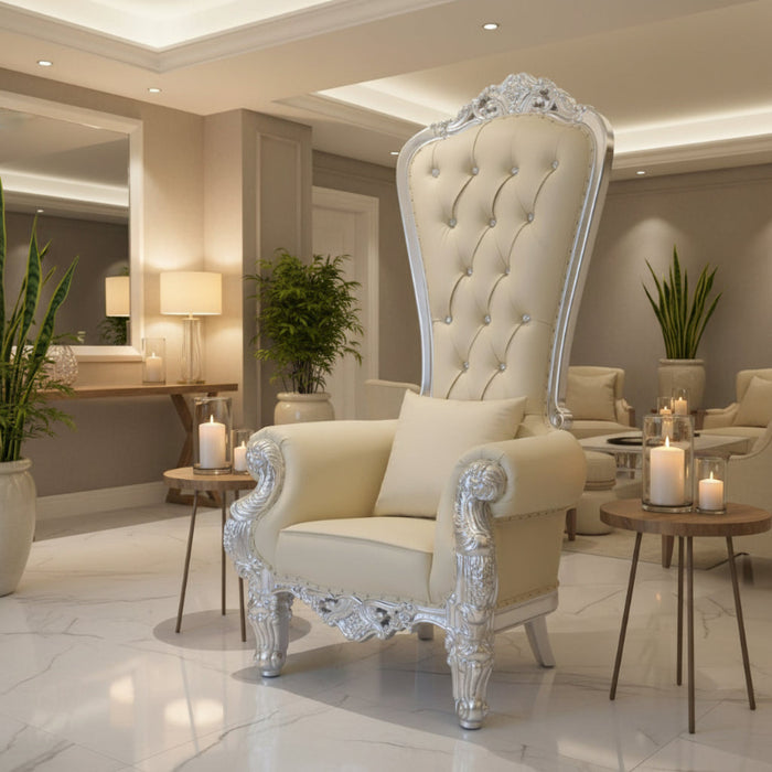 A luxurious Queen Anne-style high back throne chair with sparkling crystal tufts, a beige upholstered seat, and a silver-painted frame.