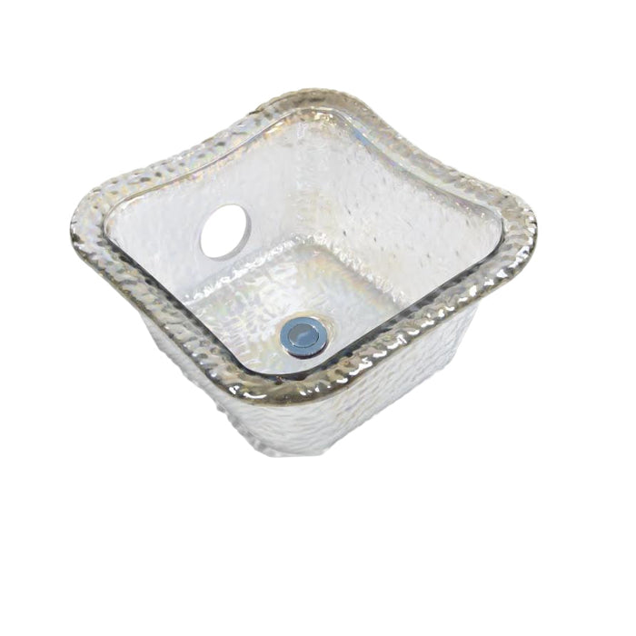 A collection of four square glass bowls in different colors: crystal, nickle, gold, and ruby. Each bowl has a hole for a jet in the center and is textured.
